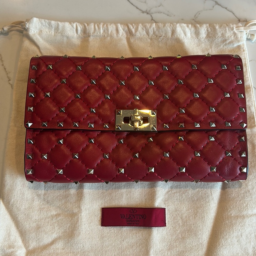 Valentino Garavani spiked leather crossbody/clutch like new with dust bag